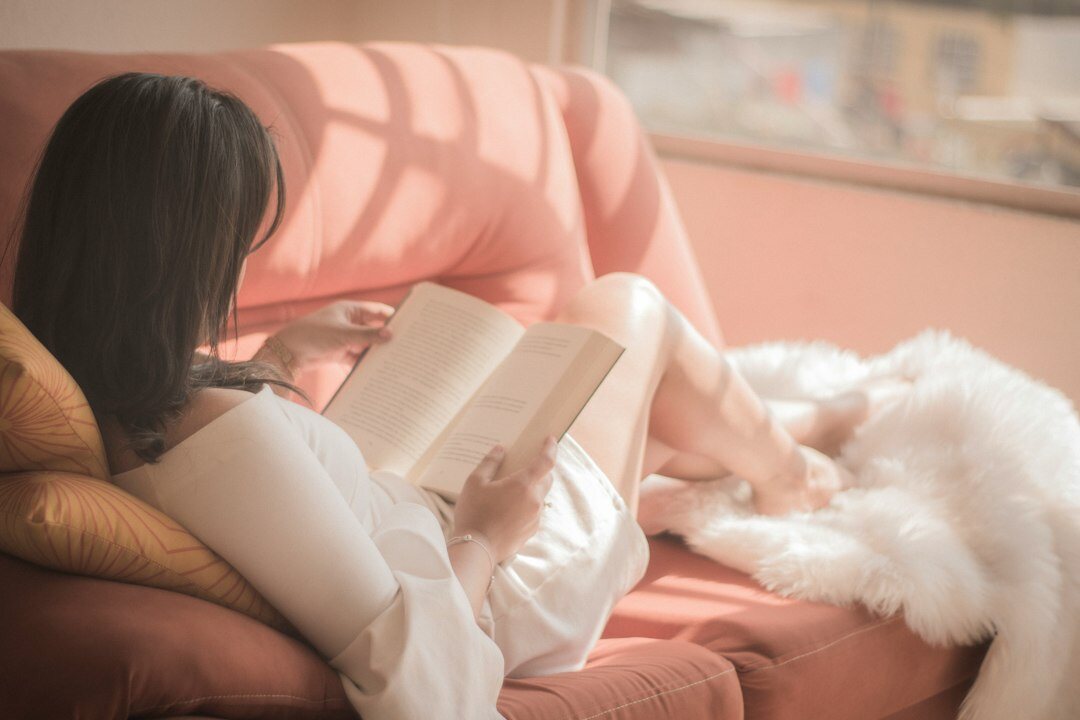 person reading mystery novel